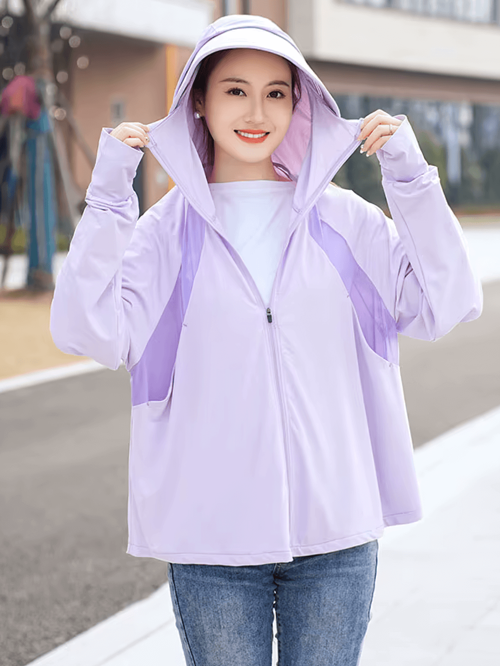 Woman wearing Stylish Hooded UV Protection Ice Silk Sun Jacket SF2306 in lavender color outdoors, demonstrating full sun coverage.