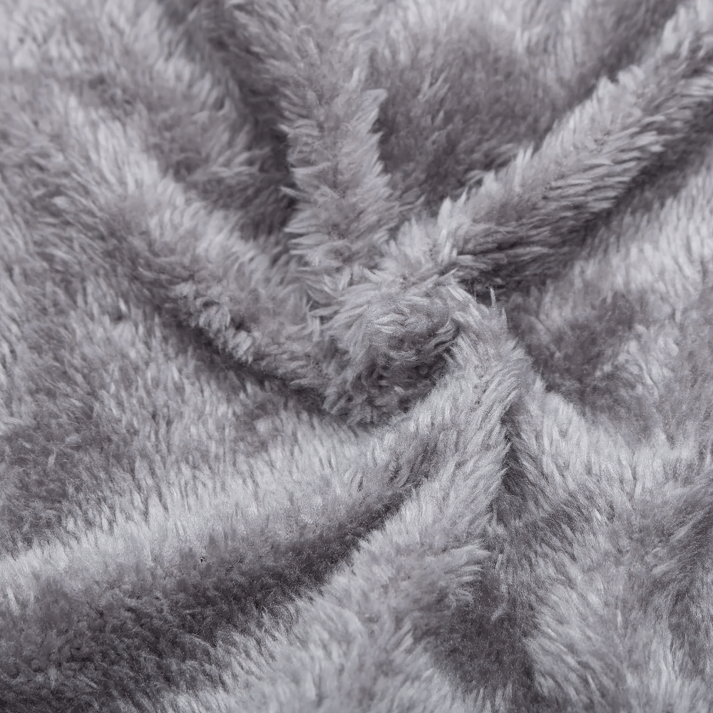 Close-up of soft grey fleece fabric, showcasing its plush texture and cozy appearance, ideal for warmth and comfort in winter clothing.