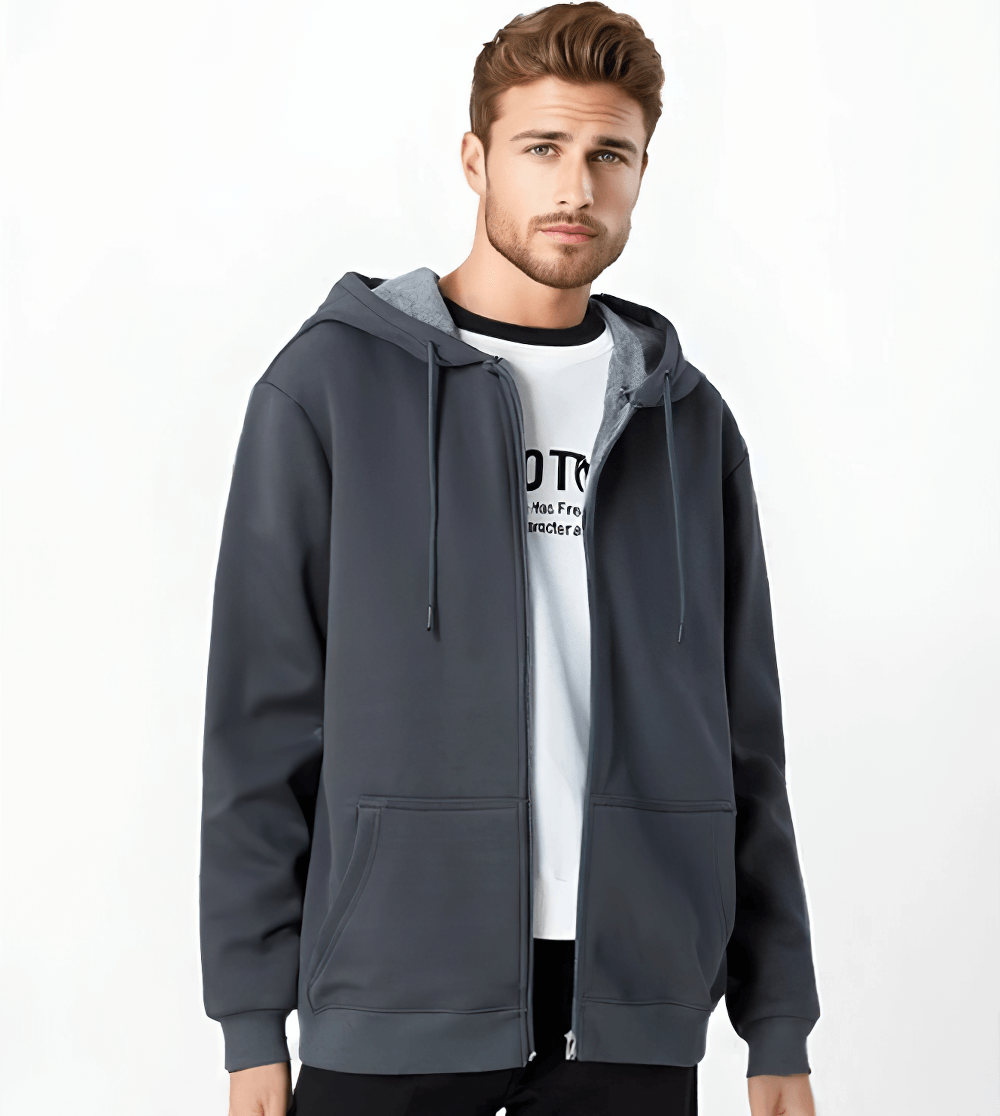 Male model wearing a stylish fleece lined zip-up hoodie in dark gray, showcasing a trendy and casual look perfect for cooler weather.