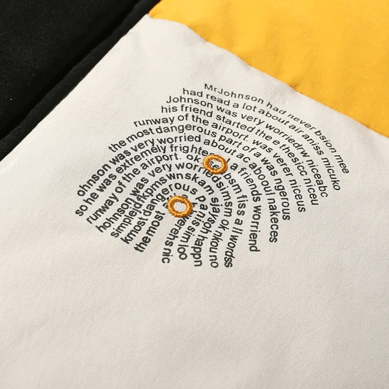 Close-up of text design on a multicolored fabric, featuring unique circular typography with contrasting colors for a stylish effect.