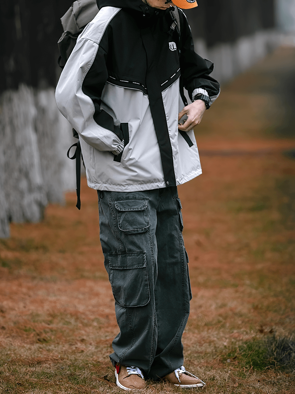 Stylish Men's Outdoor Reflective Jacket SF2273 with hood, patchwork design, and zipper closure, perfect for sportswear and outdoor activities.