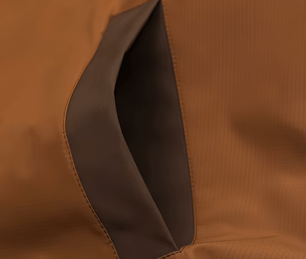 Close-up of stylish patchwork brown jacket pocket - SF2273, featuring durable polyester for men's outdoor sportswear.