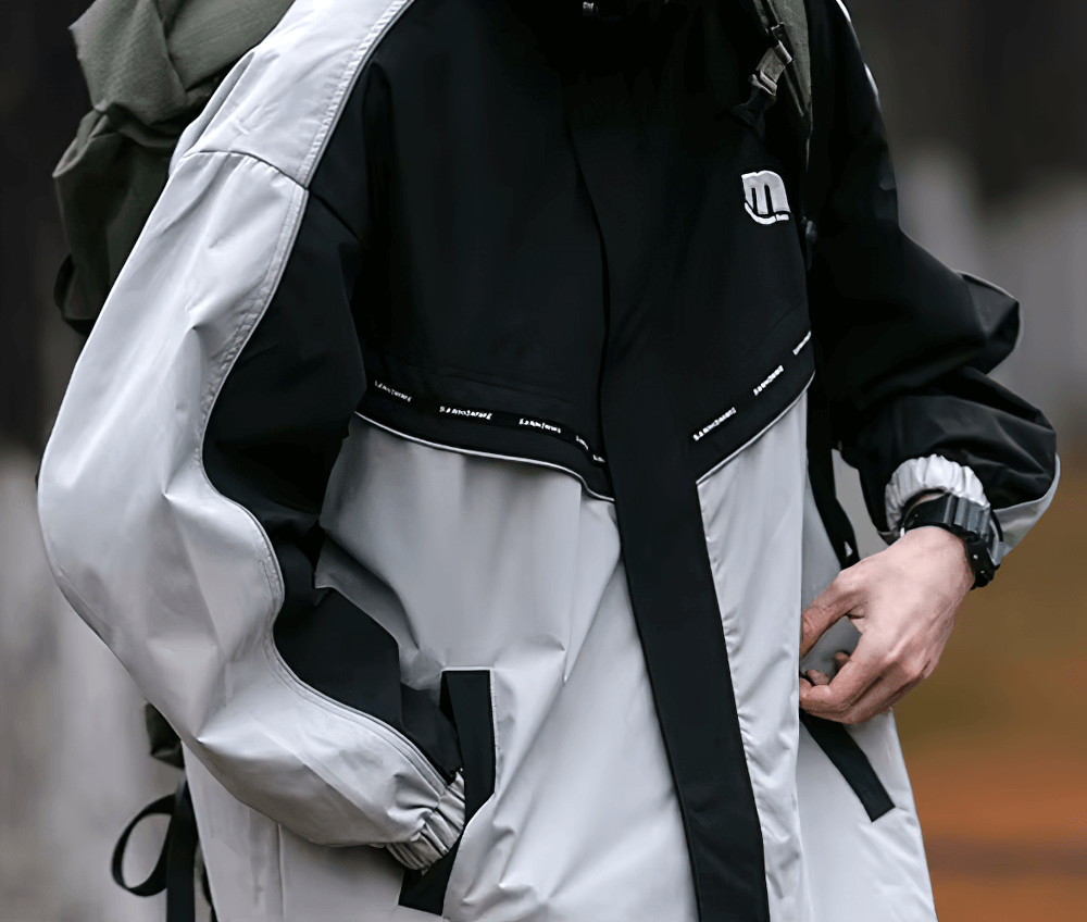 Alt Tag: Stylish reflective hooded jacket for men with patchwork design, ideal for outdoor sports. Durable polyester with zipper closure.