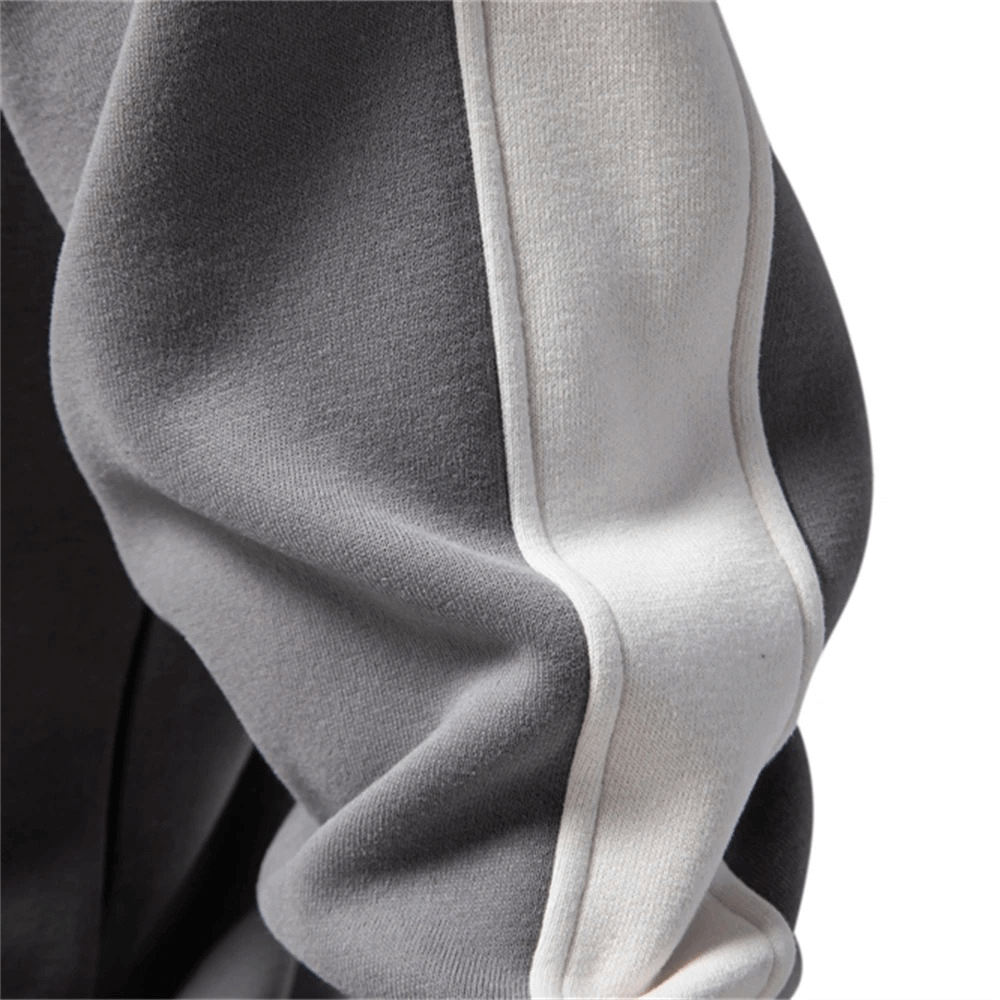 Close-up of gray polyester-cotton sport pullover with white stripe detail, showcasing stylish sleeve design of men's quarter-zip pullover.