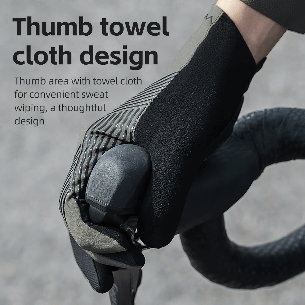 Cyclist using full finger touchscreen gloves with thumb towel design for sweat wiping, perfect for MTB and road biking.