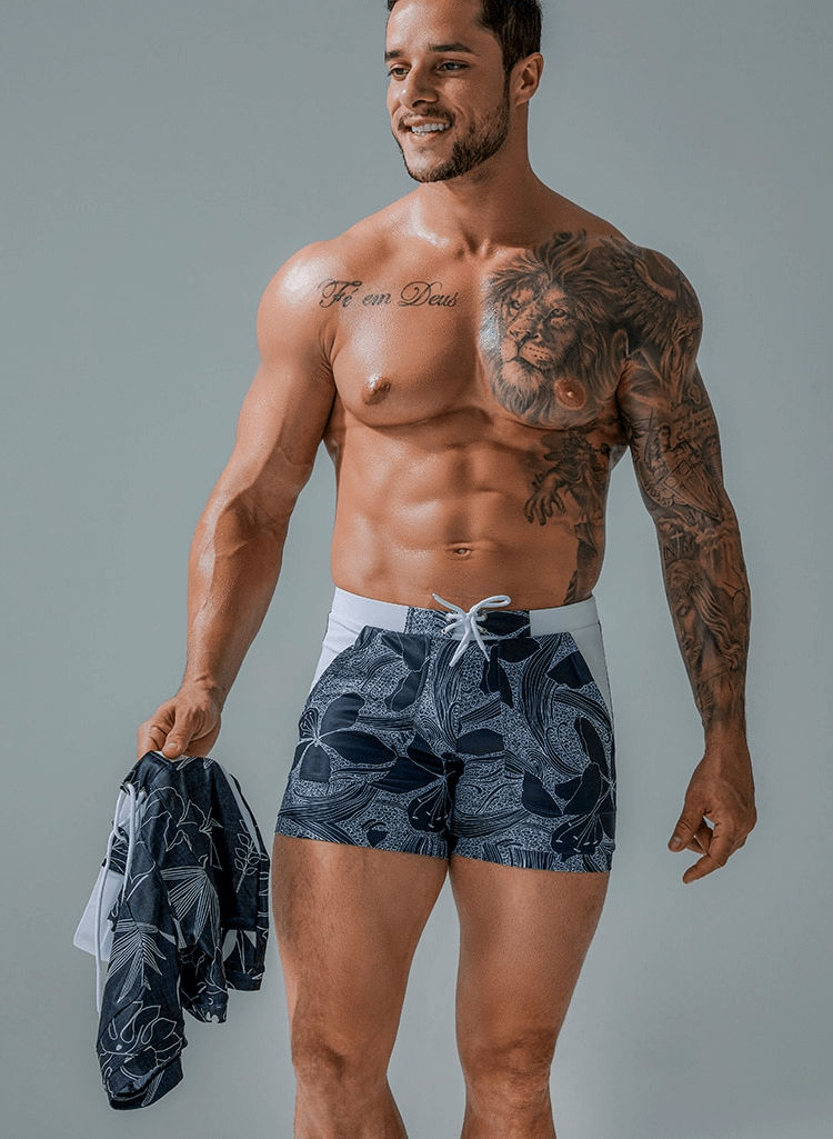 Stylish quick dry men's swim shorts with tropical print, lightweight and breathable, ideal for beach activities and comfort.