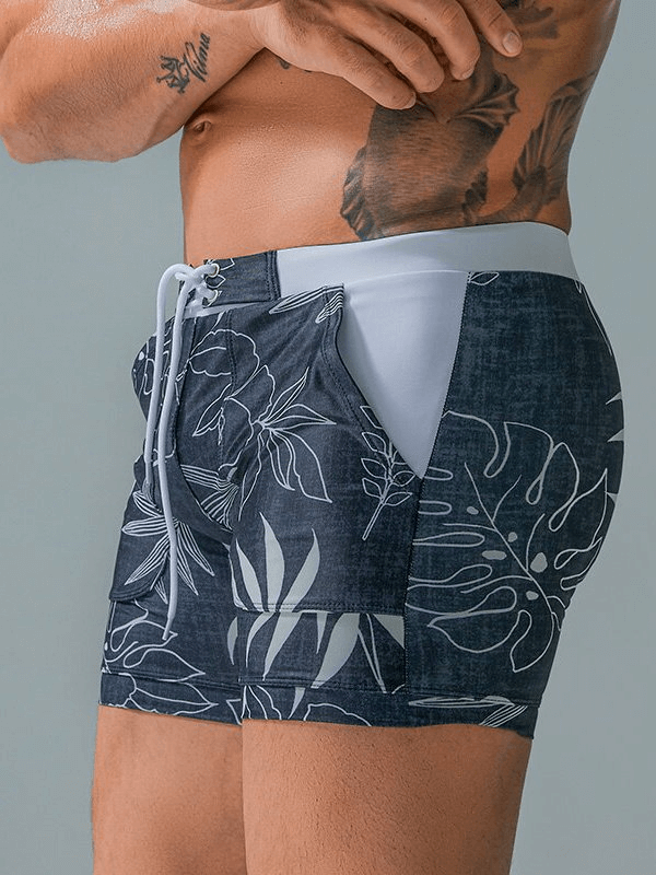 Stylish Quick Dry Men's Swim Shorts with floral print and pockets, perfect for beach activities and comfort.