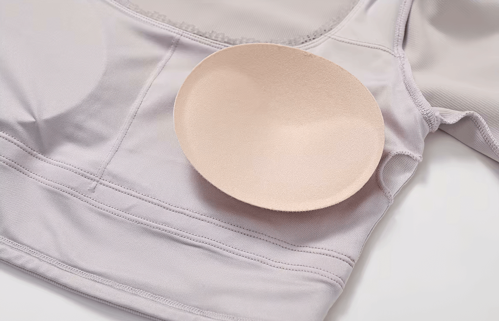 Close-up of ribbed yoga top with removable padded insert for added support.