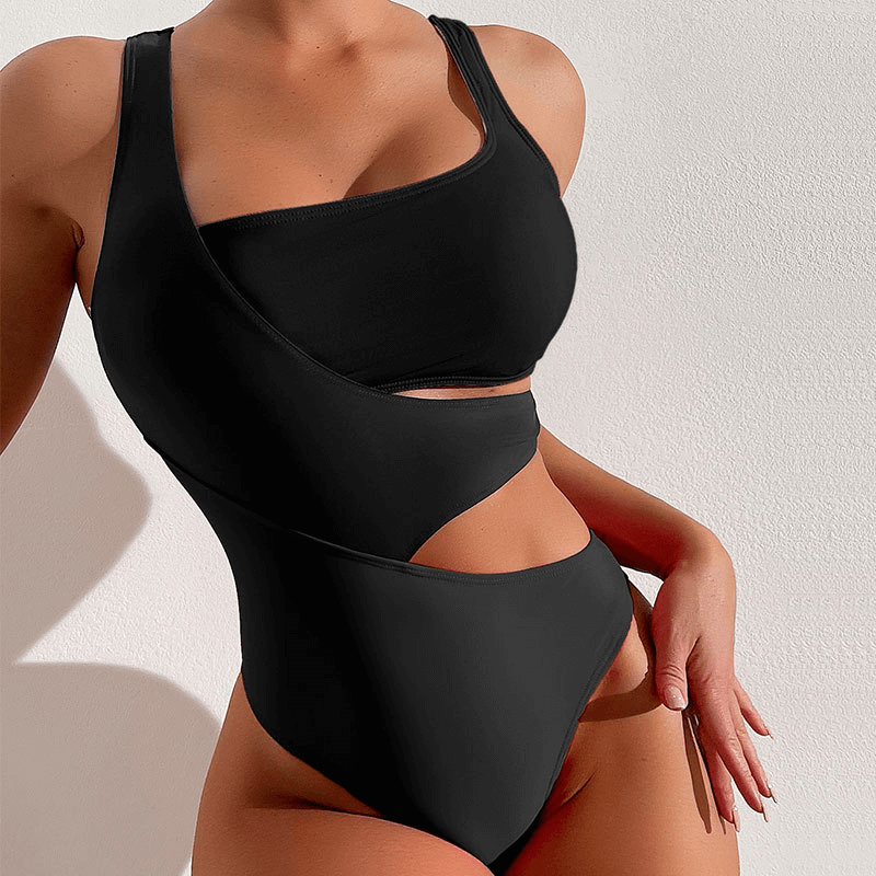 Stylish black cutout women's swimwear with adjustable straps and hollowed vintage look, perfect for beach days.