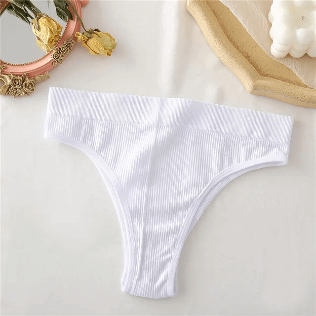 Alt Tag: Stylish seamless white G-string for women, solid pattern, low-rise fit. Perfect for chic look and smooth silhouette, made of spandex-polyester.