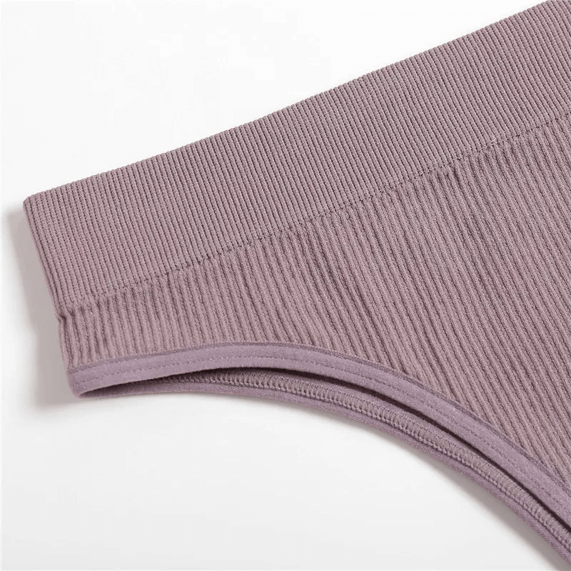 Close-up of a stylish seamless G-string in a chic mauve color, crafted from spandex and polyester for a sleek fit under clothing.