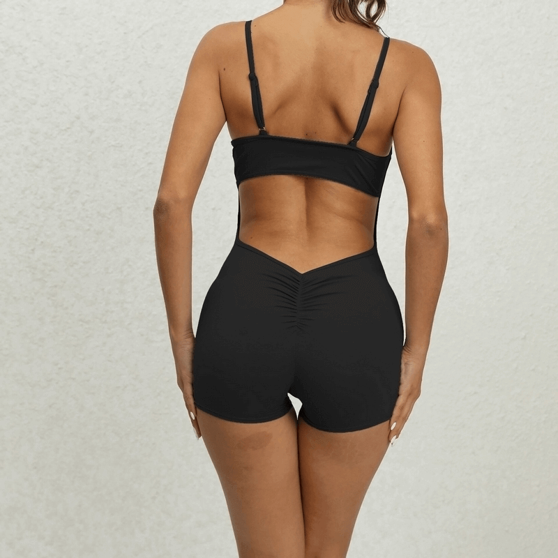 Back view of a stylish black short jumpsuit with straps for athletic girls, perfect for yoga and activewear.