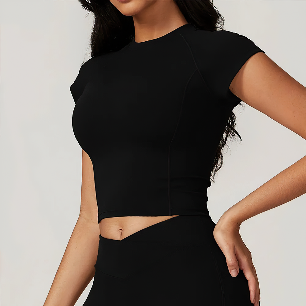 Stylish short-sleeve crop yoga top for women in black, perfect for fitness, cycling, hiking, and dancing. Anti-pilling feature included.