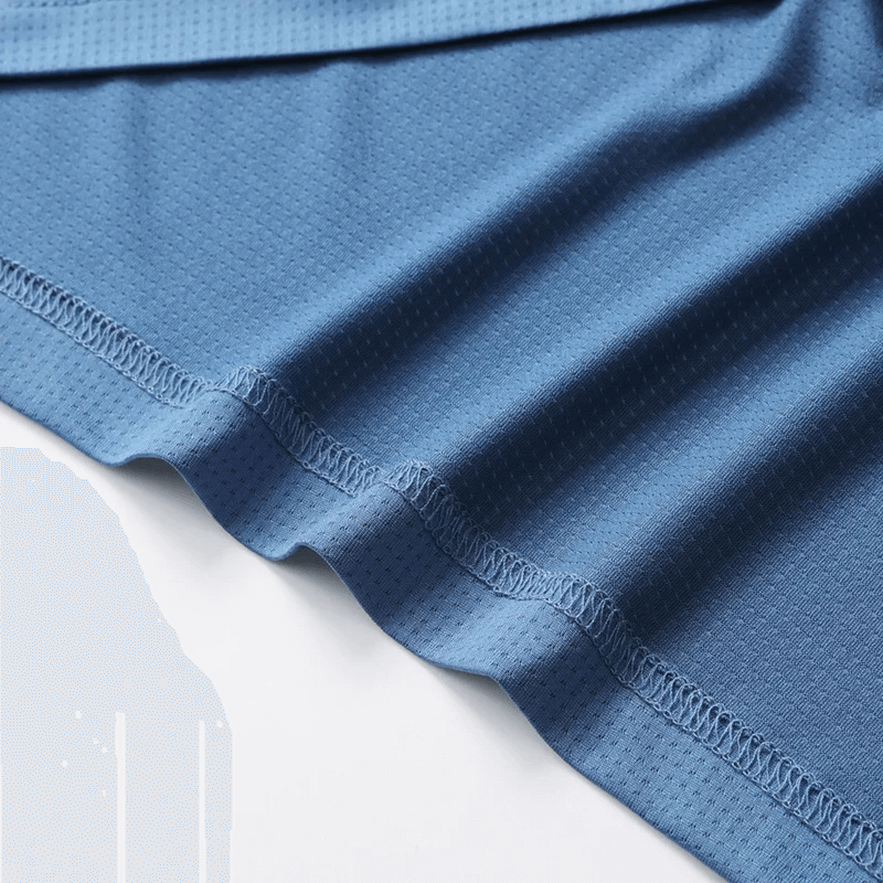 Close-up of blue polyester fabric of men's stylish sports polo shirt SF2041 with breathable texture and solid color design.