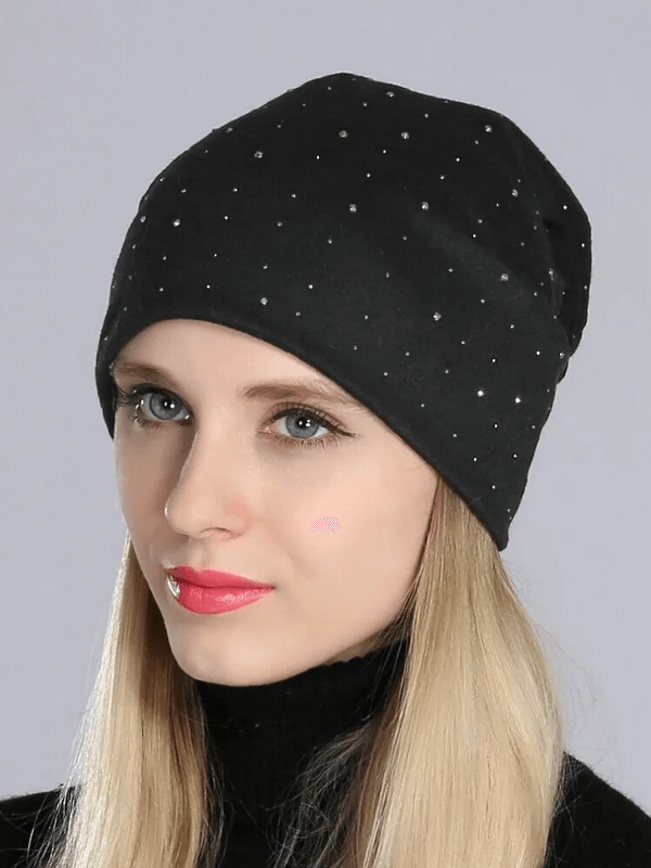 Alt Tag: Stylish solid color women's beanie with rhinestones in black, worn by model. Made from lightweight polyester, perfect for casual wear.