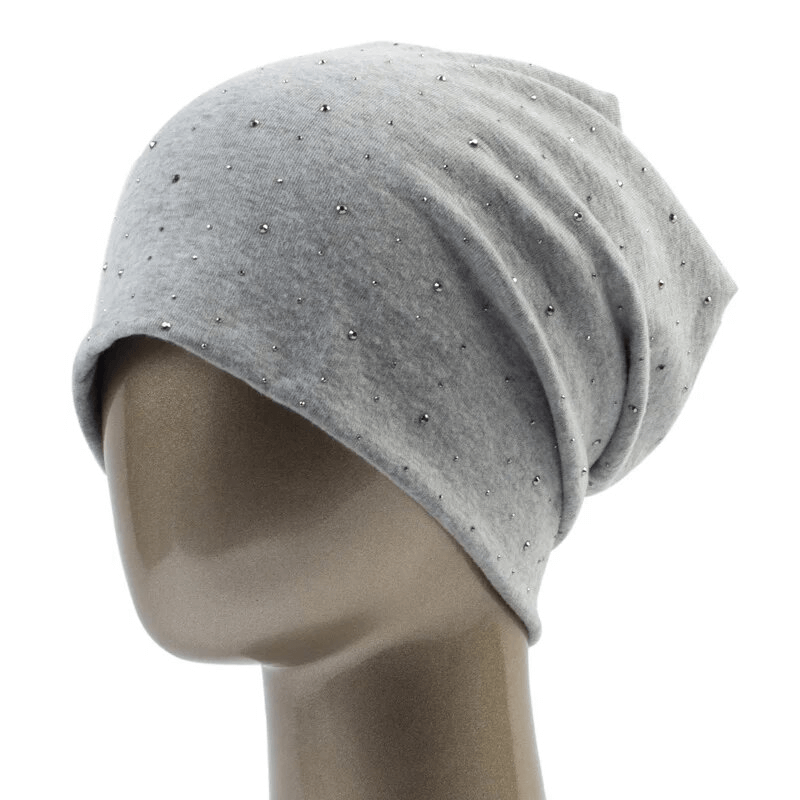 Gray women's beanie adorned with rhinestones, made from lightweight polyester, offering a stylish and cozy casual look for everyday wear.