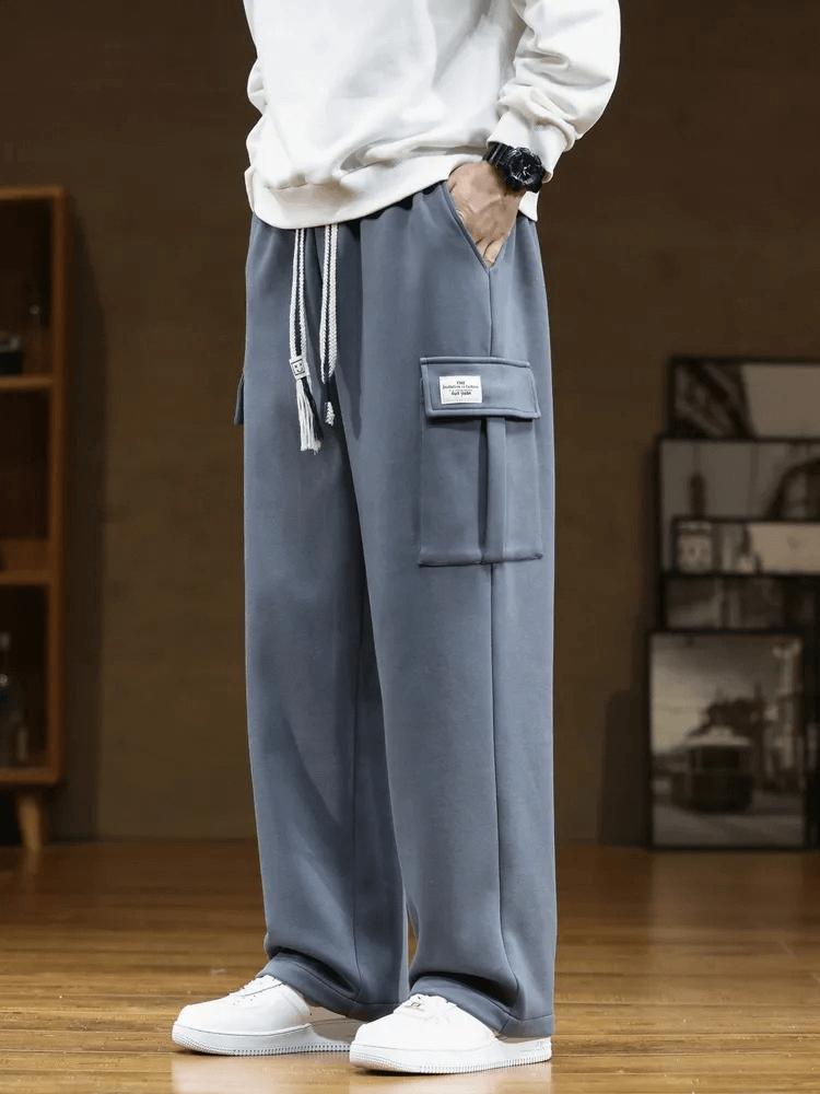 Men's stylish sports pants with multiple pockets, midrise waist, loose fit, drawstring closure, made of durable polyester and cotton.