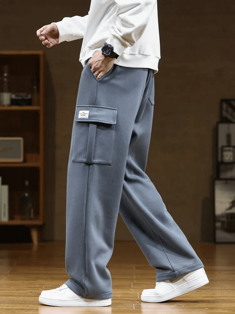 Stylish men's sports pants with several pockets and drawstring closure for a comfortable, loose fit.