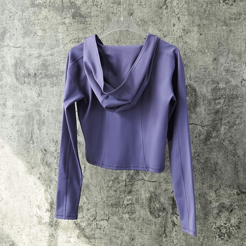Stylish sports women's top with long sleeves and hood, perfect for yoga. Breathable and quick-drying nylon-spandex fabric. SF1430.
