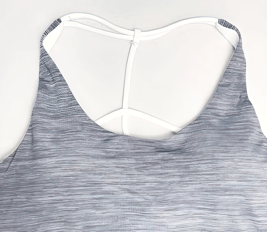 Stylish sporty women's tank top with lining and open back design, featuring quick-dry fabric ideal for yoga. SF1620 model.