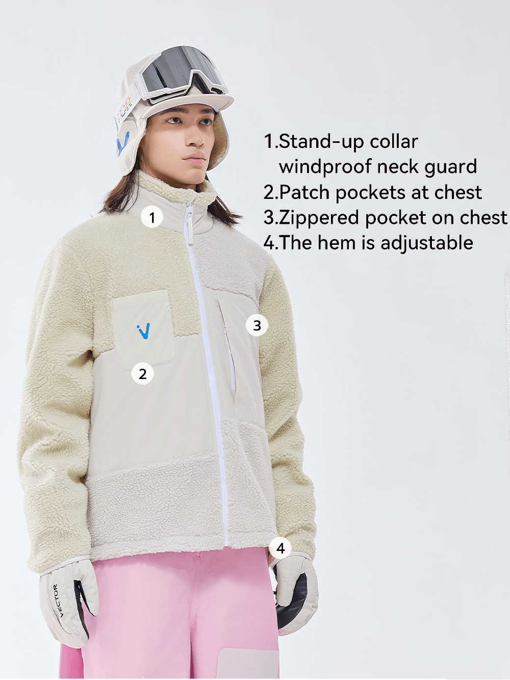 Unisex Sherpa Fleece Jacket with stand-up collar, patch and zippered chest pockets, and adjustable hem. Perfect for winter sports.