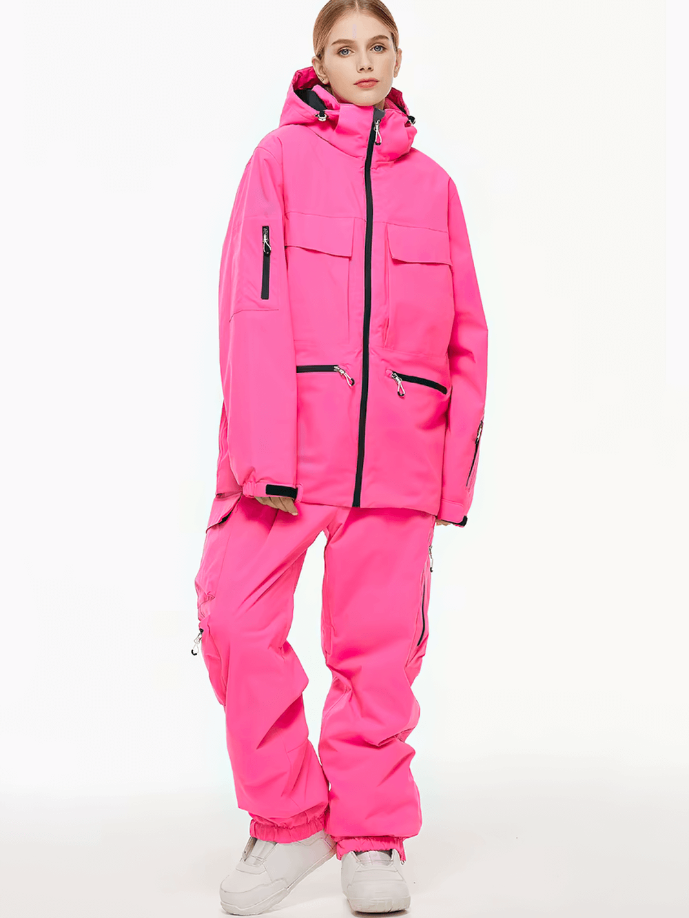 Unisex waterproof ski jacket and pants set in pink, perfect for skiing and snowboarding. Stay warm and dry with stylish design.