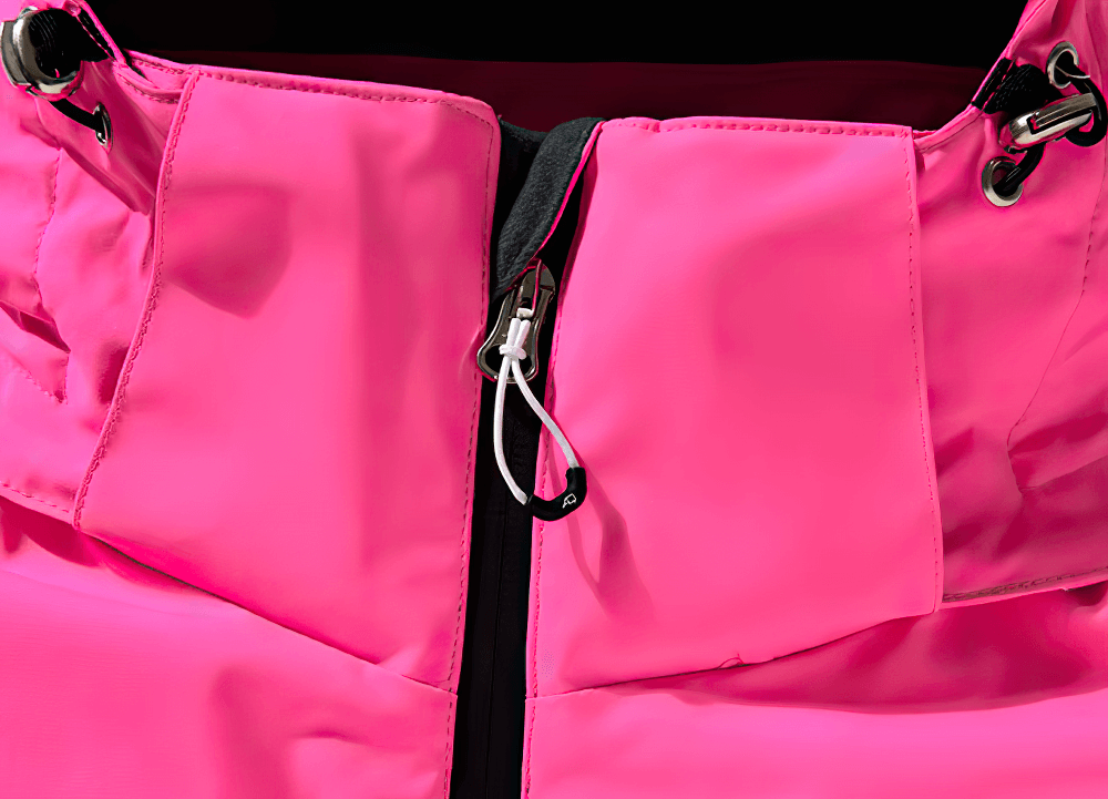 Close-up of waterproof pink ski jacket zipper from SF2558 unisex set, ideal for skiing and snowboarding in winter conditions.