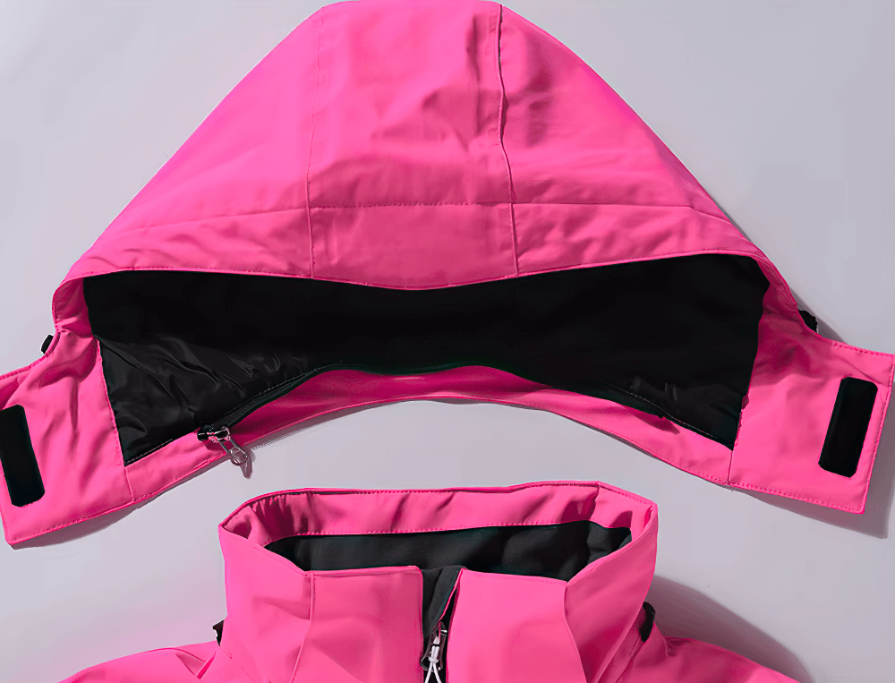 Bright pink waterproof ski jacket hood and collar detail, part of a stylish unisex snowboarding suit. Perfect for outdoor sports.