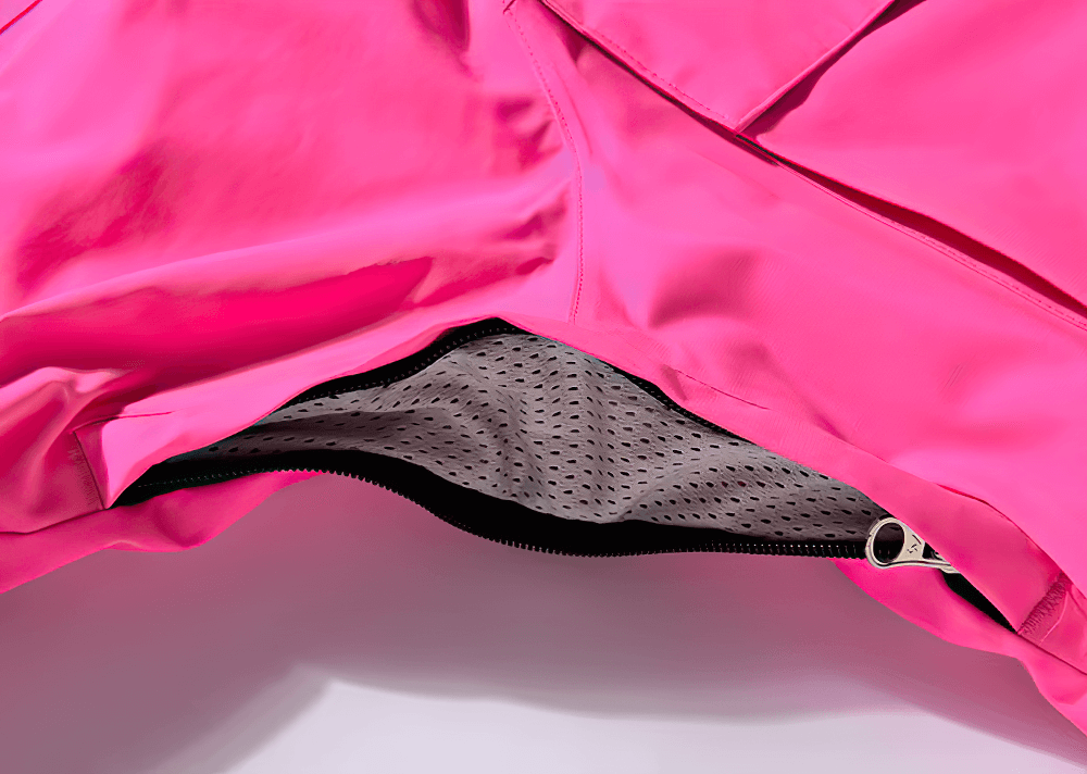 Close-up of breathable pink ski jacket showcasing inner mesh lining for warmth and comfort.