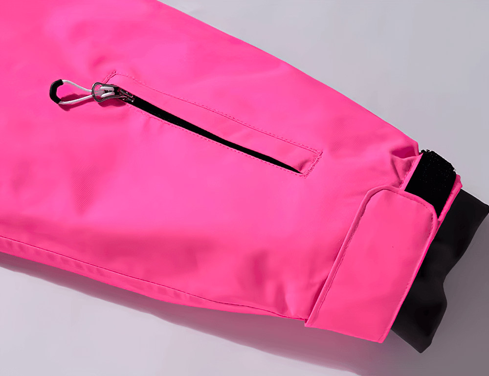 Bright pink waterproof ski jacket sleeve with zipper pocket, showcasing durable and windproof design for snow sports.