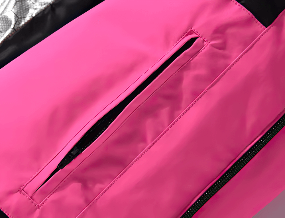 Close-up of pink waterproof and windproof unisex ski jacket pocket, highlighting durable fabric and sleek design for winter sports.