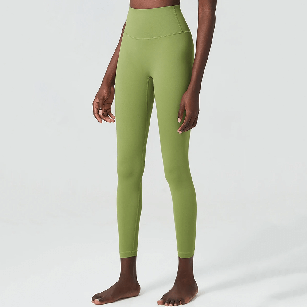 Green ankle-length yoga leggings for women with elastic waist, perfect for diverse activities like yoga, gym, and running in all seasons.
