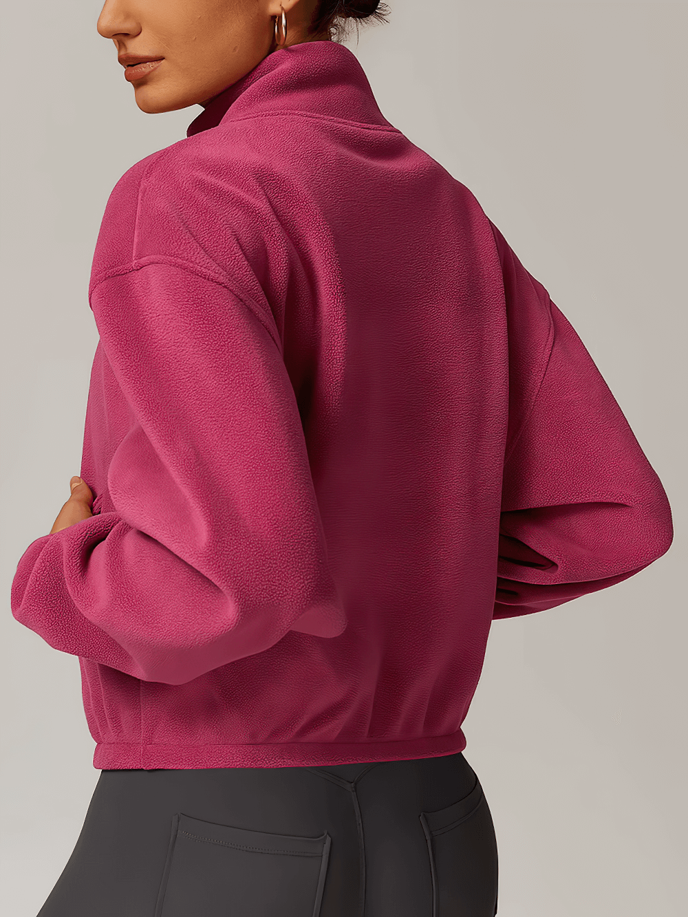 Back view of a pink stylish women's anti-pilling fleece jacket, perfect for outdoor activities like running, cycling, and hiking.