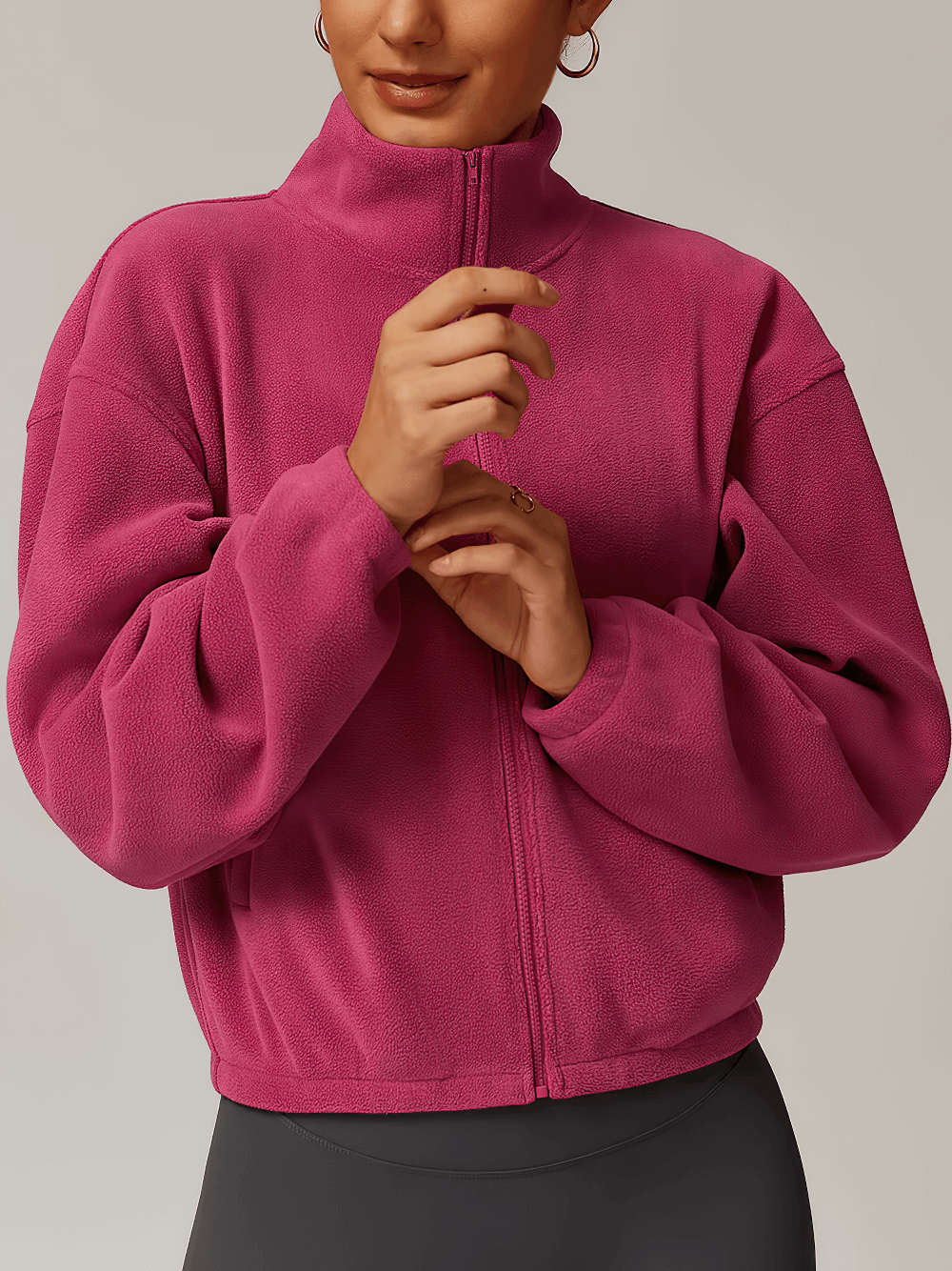 Women's anti-pilling fleece jacket in pink for outdoor activities, featuring a full-zip design and windproof fabric.