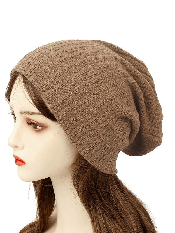 Stylish women's beanie with decorative stripes, made from soft cotton and polyester blend, perfect for casual wear.