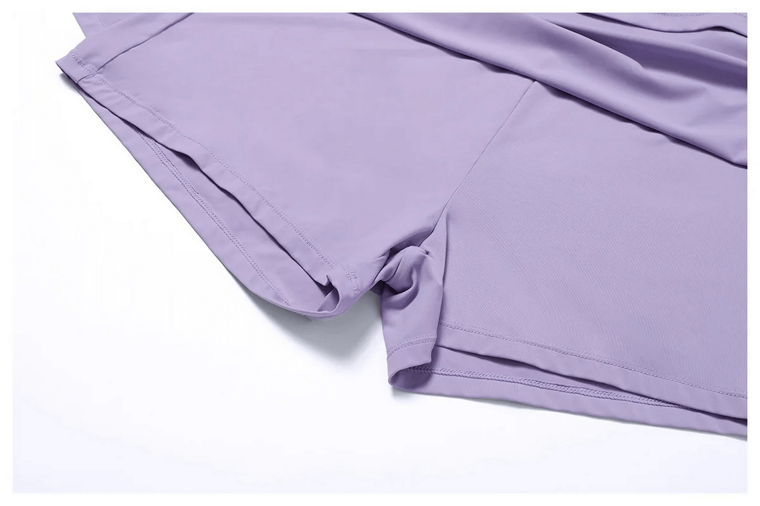 Close-up of lavender women's flared sports skirt showcasing nylon and spandex fabric, ideal for running, yoga, and dance activities.