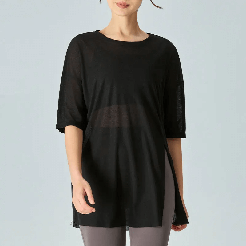 Chic black short-sleeved women's loose-fit tunic t-shirt with elegant drape, perfect for layering or standout style.