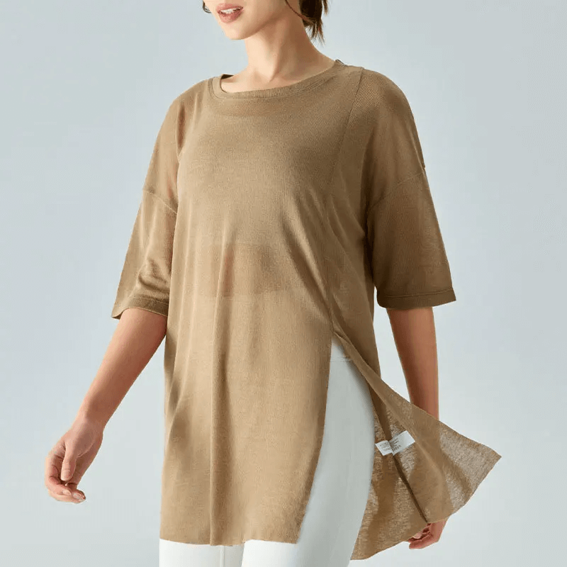 Woman wearing a stylish loose-fit brown tunic t-shirt with short sleeves, perfect for layering. Lightweight and breathable for casual style.