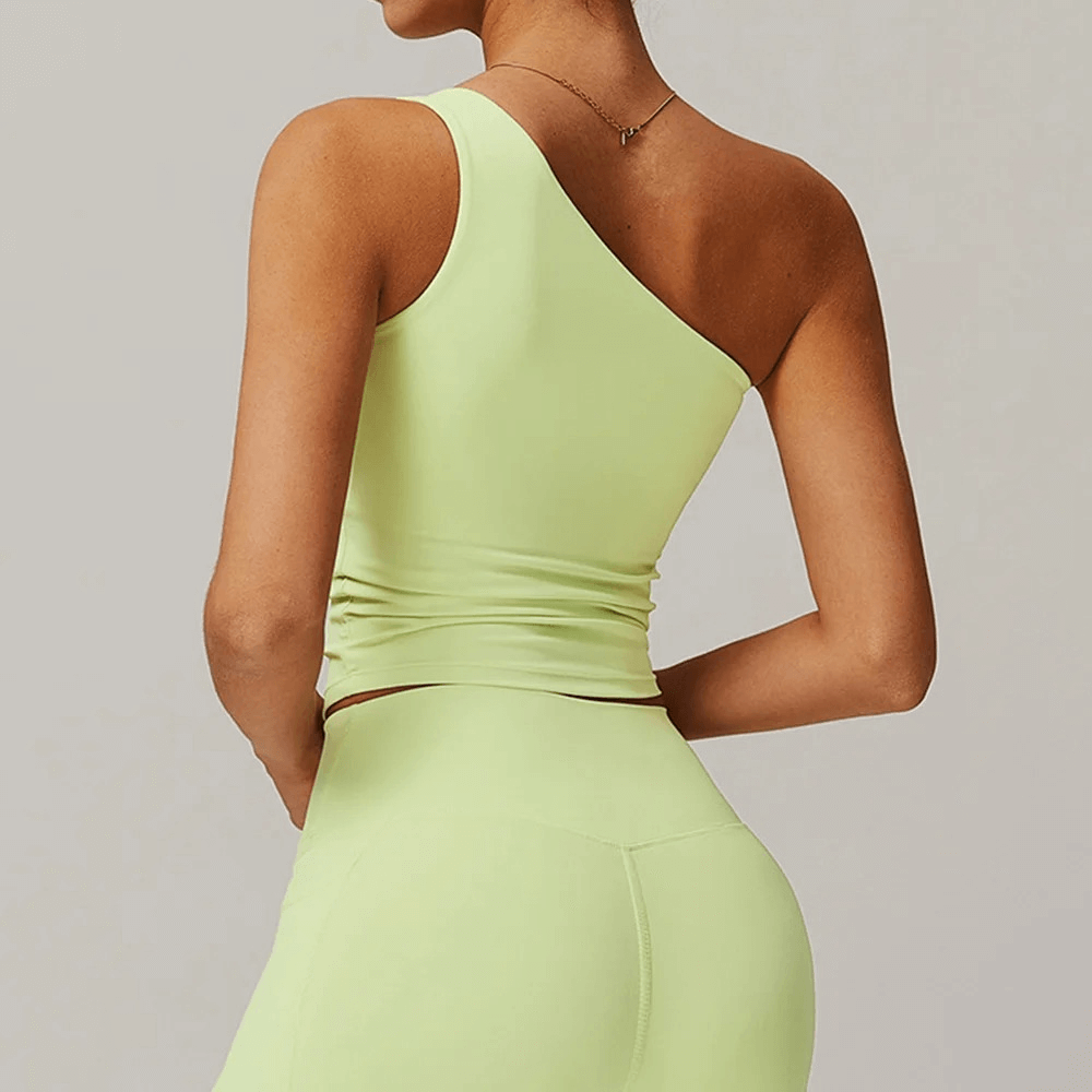 Stylish women's one-shoulder fitness tank top SF2439 in green, perfect for running, dancing, with breathable, quick-dry nylon material.