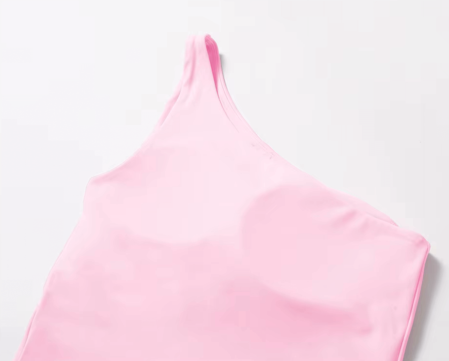 Stylish pink one-shoulder fitness tank top for women, made from nylon and spandex; breathable and quick-dry design. SF2439.