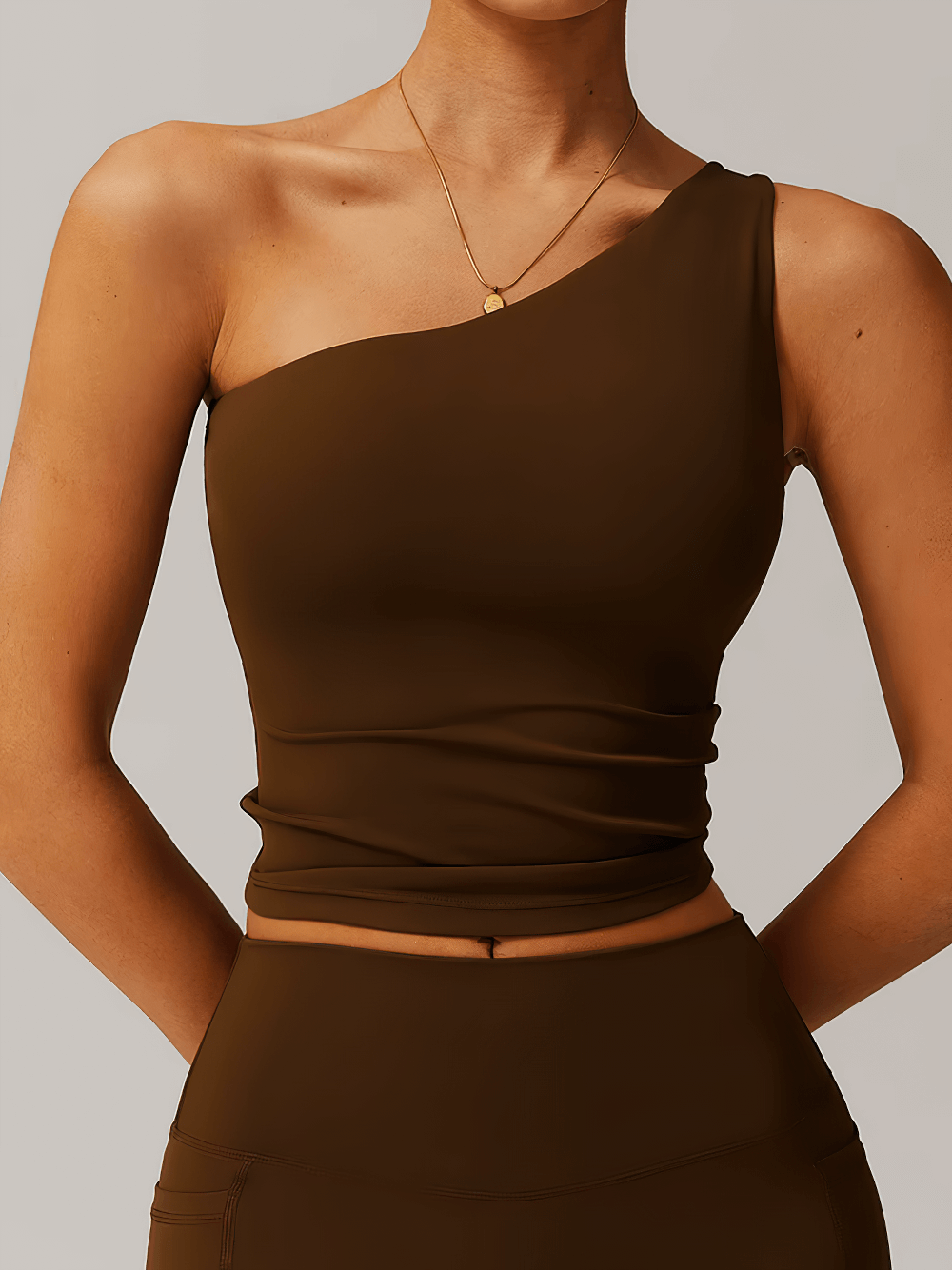 Stylish Women's One-Shoulder Fitness Tank Top in brown - SF2439, featuring elegant cut and breathable, quick-dry fabric for active wear.