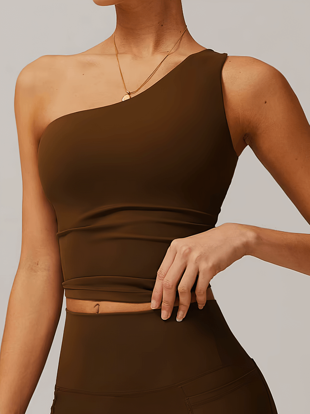 Stylish women's one-shoulder fitness tank top in brown for running, dancing, and workouts; breathable with excellent support, model SF2439.