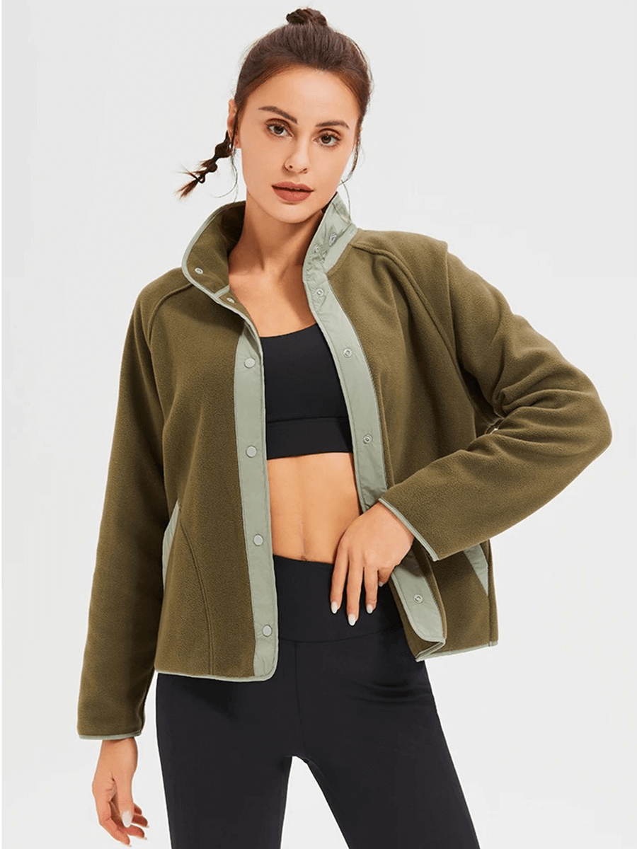 Woman wearing a stylish windproof wool sports jacket, perfect for winter running with a sleek mandarin collar. SF2009 model.