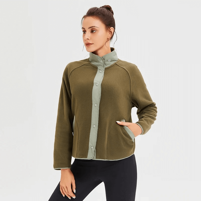 Woman wearing a Stylish Wool Sports Jacket for Running with mandarin collar in olive green, perfect for winter running enthusiasts.