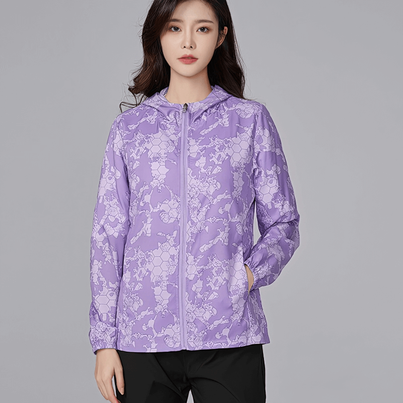 Purple sun-protective women's waterproof windbreaker jacket with zipper, ideal for hiking and camping. Model showcasing the jacket.