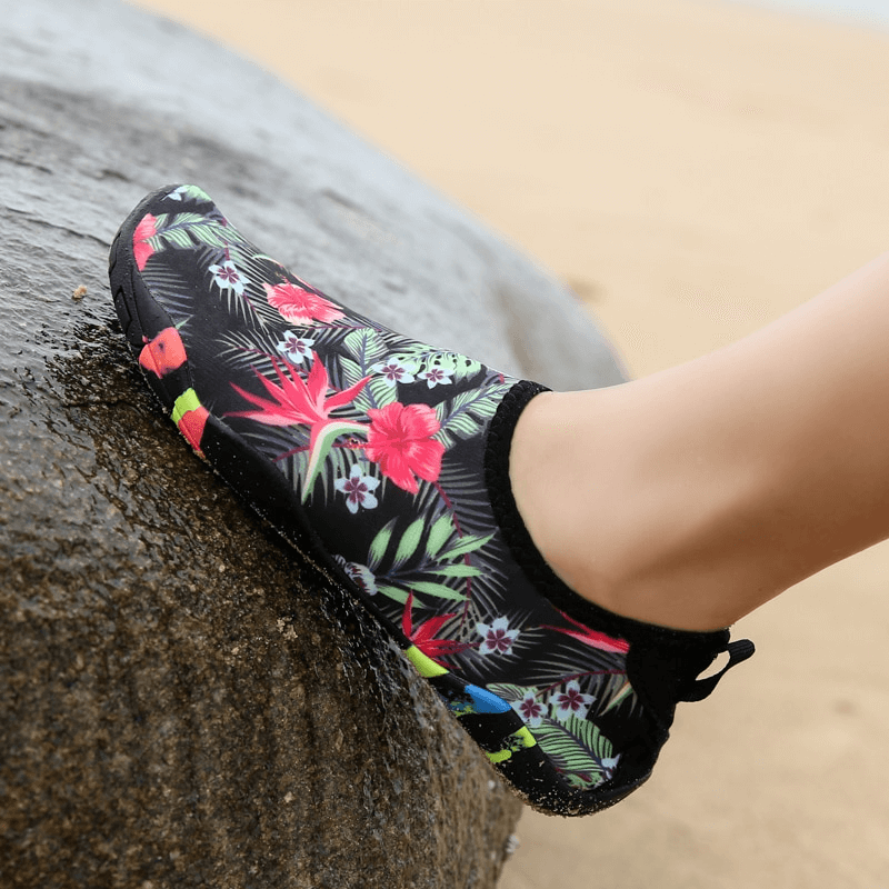 Unisex quick-dry beach shoe with tropical print on rock, perfect for swimming and slip resistance.