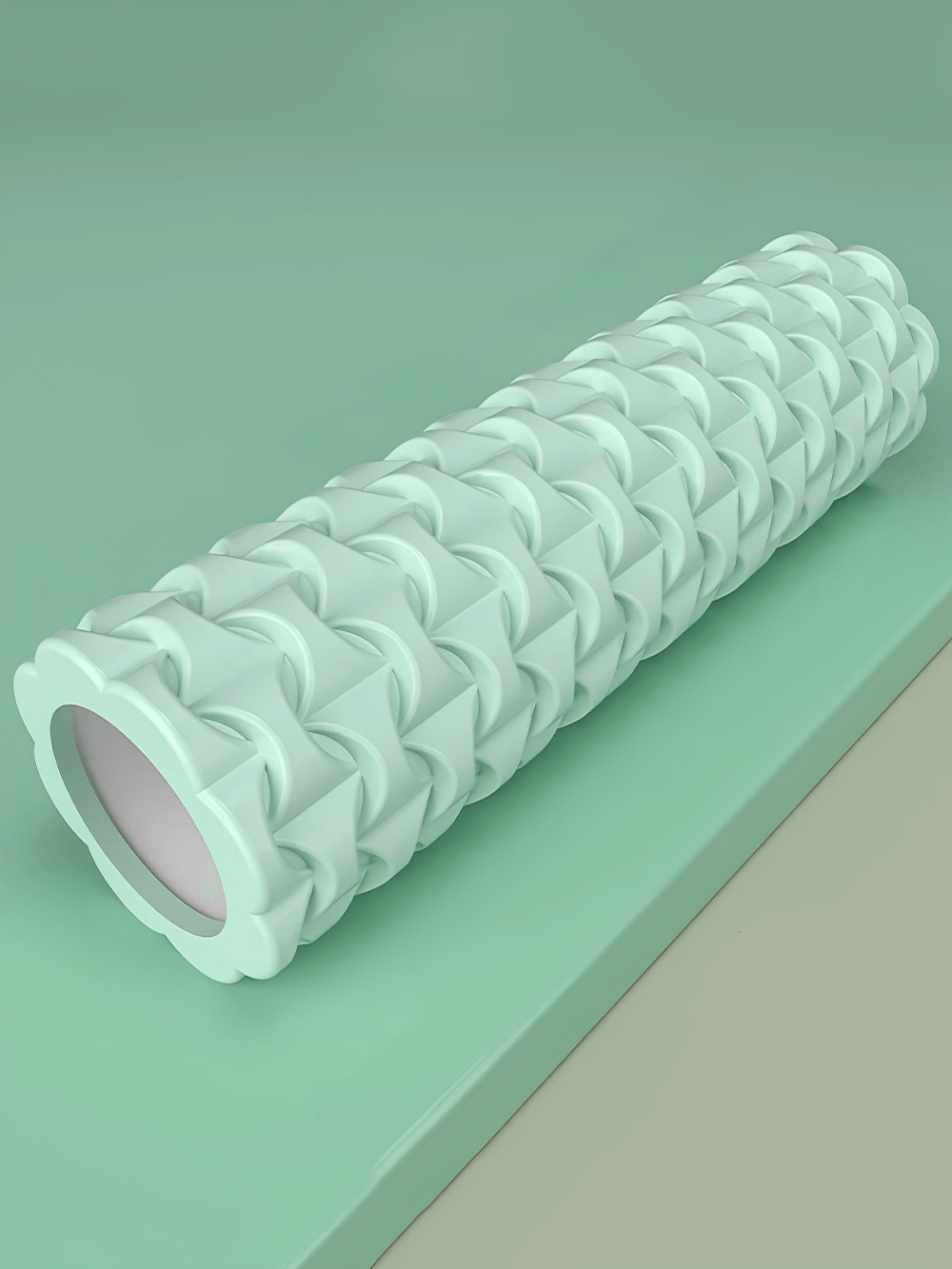 Textured 40cm foam roller for yoga and fitness, perfect for deep tissue massage and muscle recovery, in a soothing green color.
