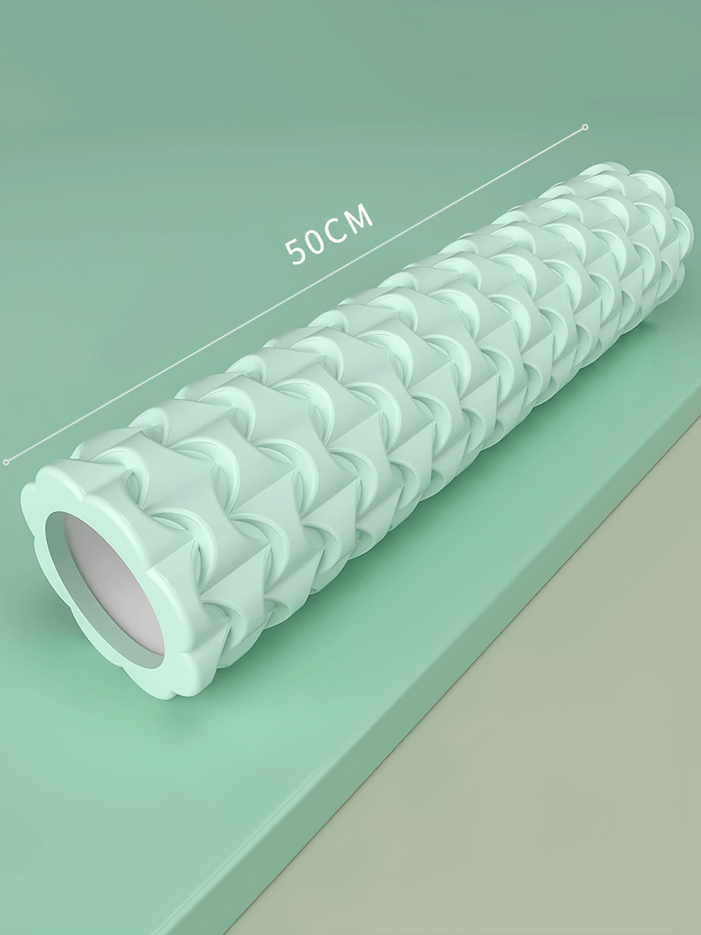 Textured 50cm foam roller for yoga and fitness, ideal for muscle recovery and deep tissue massage, shown on green background.