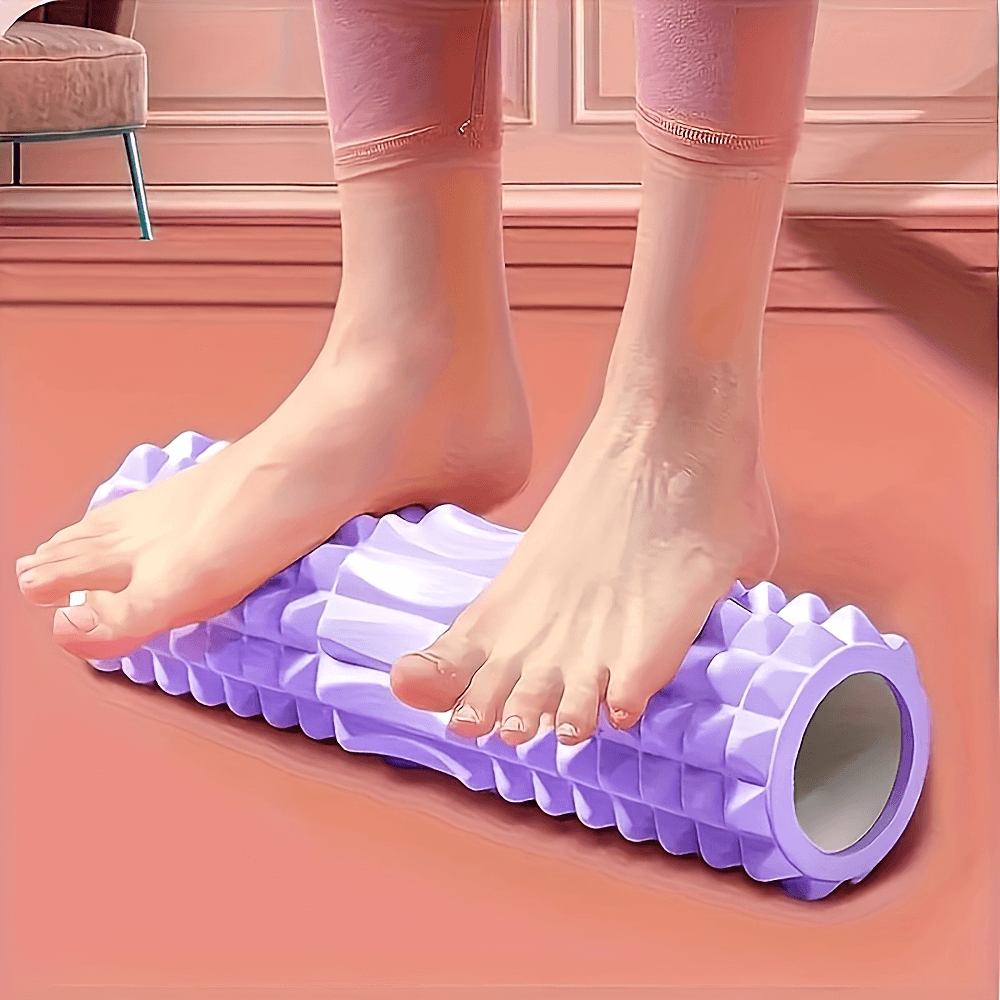 Person using a textured foam roller for muscle massage and recovery, ideal for Pilates, yoga, and fitness routines.