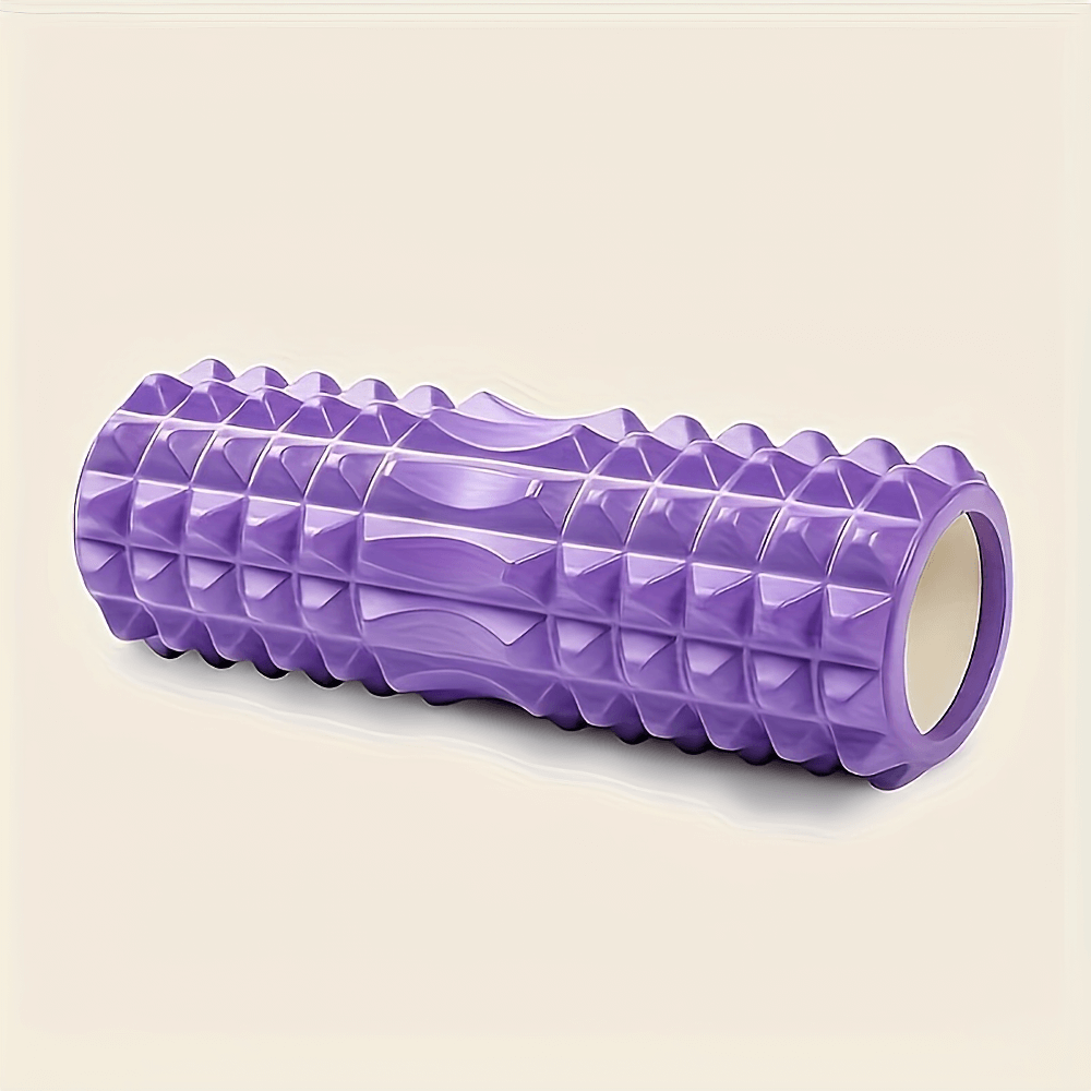 Purple textured foam roller for deep tissue massage, ideal for yoga, Pilates, and fitness routines. Compact and lightweight design.